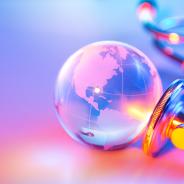 A globe lies next to the diaphragm of a stethoscope.