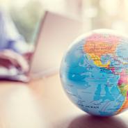 A globe sits on a desk.