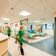 Nurses walk inside a hospital.
