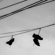 Shoes hang from a power line.