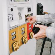 A person pays for gas at the pump.
