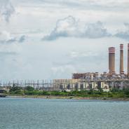 A Pemex refinery in Mexico, viewed from across a body of water.