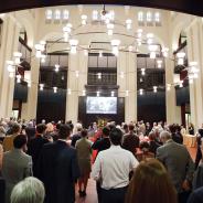 Event attendees enter Doré Commons for a reception