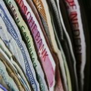 International paper currencies stacked together, showing range of colors and styles
