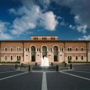 The front of Baker Hall, from across the plaza, with fountain in foreground