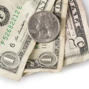A coin and dollar bills.