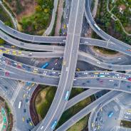 Cars drive on highways.