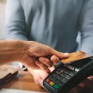 A person pays with credit card.