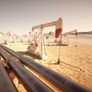 Pump jacks and pipelines move oil through the desert