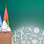 View of a lectern with flags of the United Nations and the United Arab Emirates