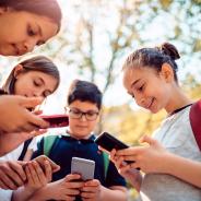  Kids playing video games on smart phone after school