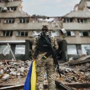 Ukrainian military woman with the Ukrainian flag 