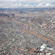 The Rio Grande River, that runs down the center of this photo, marks the US-Mexico Border