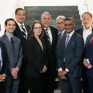 Group of event speakers posing for photo