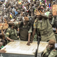 Members of the Malian junta wave as civilians gather to celebrate the overthrow of the president on Aug. 21, 2020.