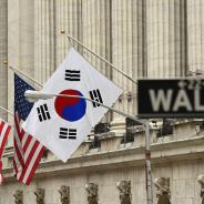 The South Korean flag (R) flies with US flags outside the New York Stock Exchange before South Korea's Ambassador to the US, Ahn Ho-Young rang the opening bell at the NYSE May 13, 2014 in New York.