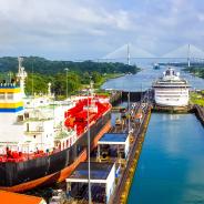 Two cargo ships transiting the Panama Canal.