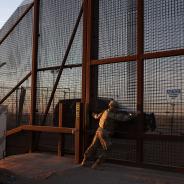 A member of the Texas Military Department opens a fence along the US-Mexico border in El Paso, Texas on January 22, 2025. On his first day back in office US President Donald Trump declared a national emergency at the southern border "to repel the disastrous invasion of our country." 