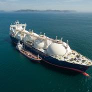 A small tanker on the roadstead bunkers a large LNG tanker