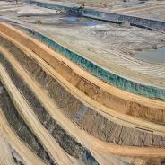  Aerial view of industrial terraces on mineral open pit mine.