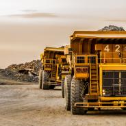 Mining dump trucks transporting Platinum ore for processing