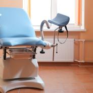 Gynecological exam chair in doctor's office