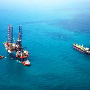 Oil rigs sitting in the ocean