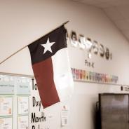 Texas and American flags displayed in pre-kindergarten classroom.