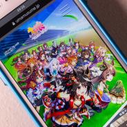 image of anime game on a mobile phone