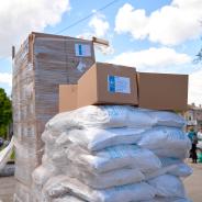 Humanitarian food aid unloaded in front of humanitarian center.