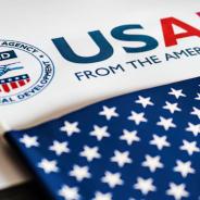 USAID logo letterhead and US flag in foreground 
