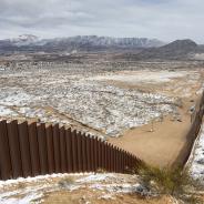 Snowy view of U.S.-Mexico border wall between Ciudad Juárez and El Paso