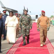 military officers on red carpet at airport