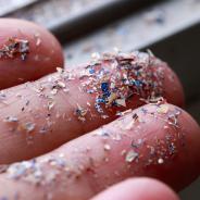 Close up side shot of microplastics lay on hand