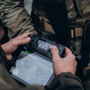 A group of Ukrainian military using tablet to operate the drone.