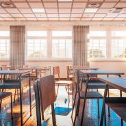 high school classroom with desks/tables and chairs