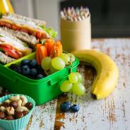 Packed school lunch on kitchen background