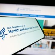 Mobile phone with logo of American Department of Health and Human Services (HHS)