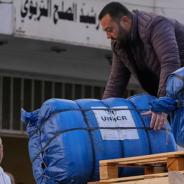  A man unloads humanitarian aid supplied by the U.N. refugee agency UNHCR at a school in Beirut used as a shelter for people displaced by Israeli airstrikes.