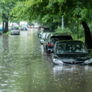 Flooded cars on the street of the city.