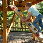 Child at play on colorful playground equipment
