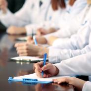 Medical workers working in conference room.