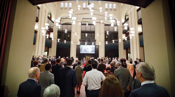 Event attendees enter Doré Commons for a reception