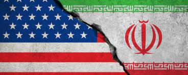 The flags of the U.S. and Iran fusing together as stone.