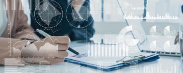 Person looking at graphs and charts