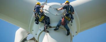 Engineers working on a wind turbine
