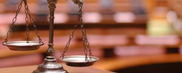 Unbalanced scales of justice.