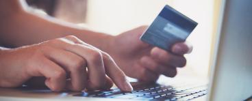 Credit card being used for online shopping
