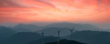 Windmills in front of a sunset