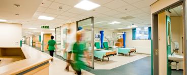 Nurses walk inside a hospital.